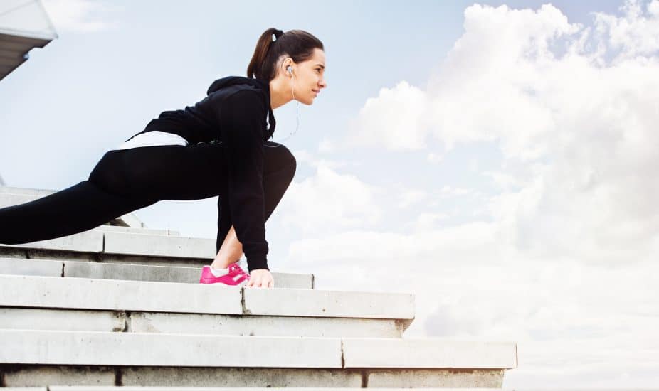 Young woman exercising in urban environment