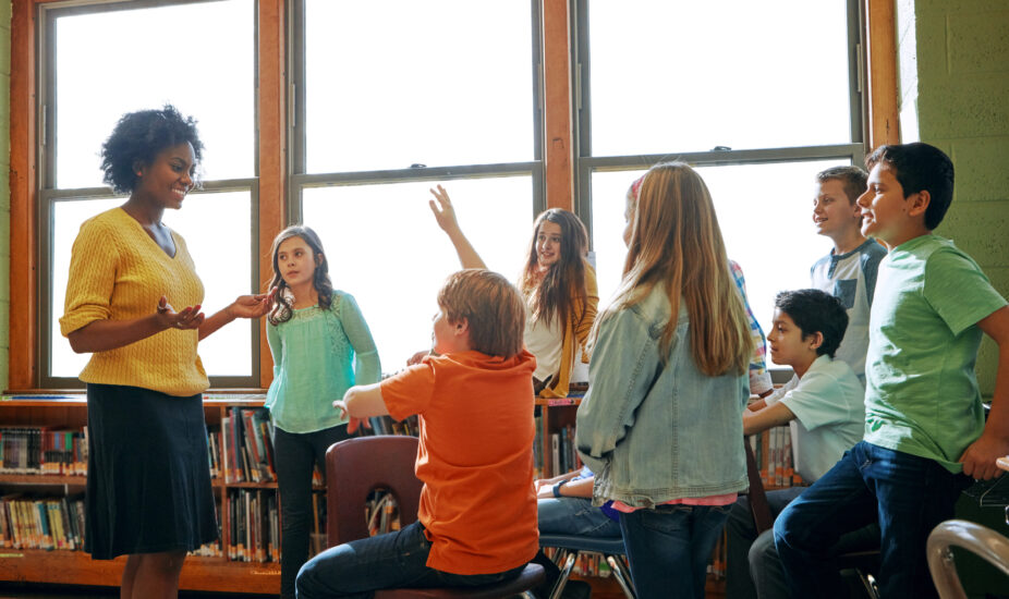 Educator in classroom teaching red ribbon curriculum